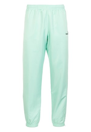 Licht mintgroene sportbroeken van glad nylon, met een elastische tailleband en boorden, voorzien van subtiele branding aan één kant.