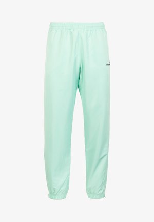 Pantaloni sportivi verde menta chiara realizzati in nylon morbido, con vita e polsini elasticizzati, presentano un logo sottile su un lato.