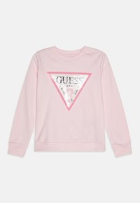 Rosa hettegenser med et trekantet paljett-logo i hvitt og sølv, samt teksten "GUESS U.S.A." og et hjerte-design. Lange ermer, ribbede mansjetter.