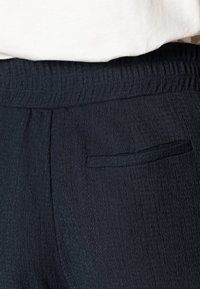 OPUS Spodnie materiałowe