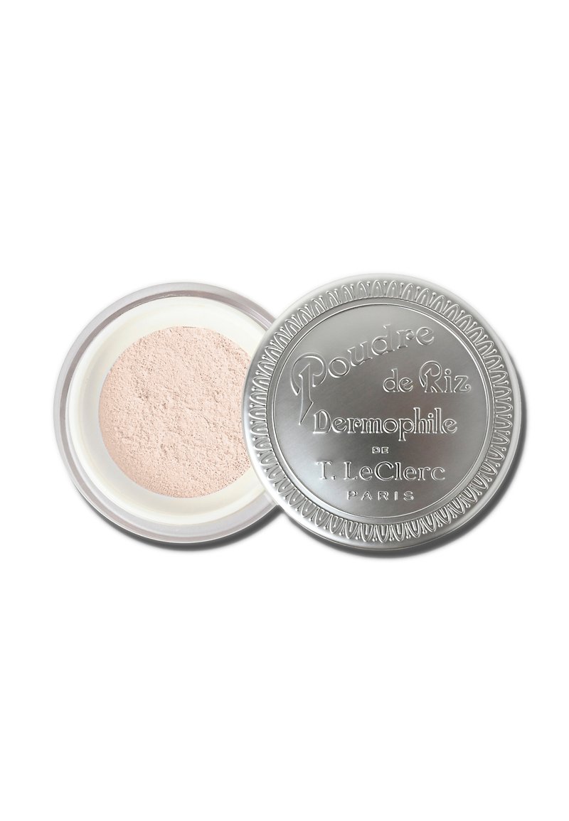 Powder in a round silver compact with textured lid and embossed text, featuring light pink, finely milled powder inside.