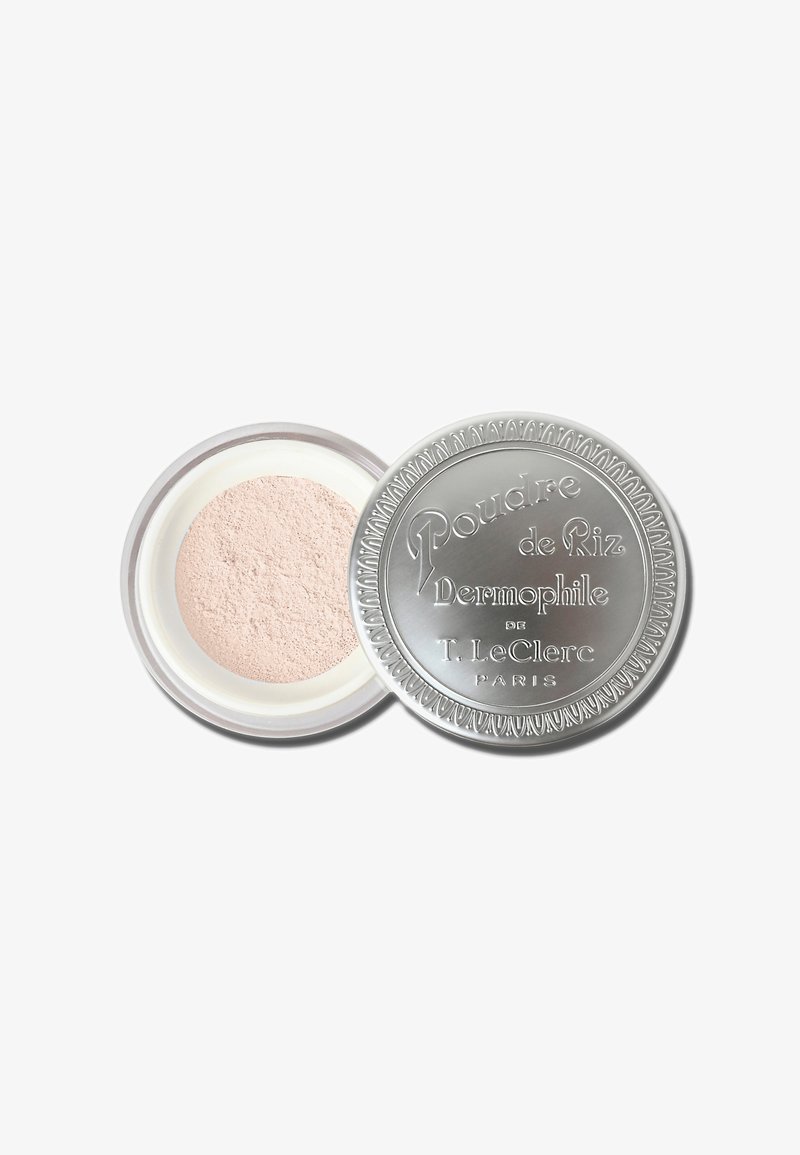Powder in a round silver compact with textured lid and embossed text, featuring light pink, finely milled powder inside.