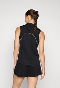 Black sleeveless athletic top with a high collar, featuring a curved seam design and a flared hem. Smooth fabric with light texture.