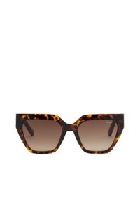 Lunettes de soleil carrées oversize en écaille avec des verres marron dégradés et un logo discret de la marque dans le coin supérieur du verre droite.