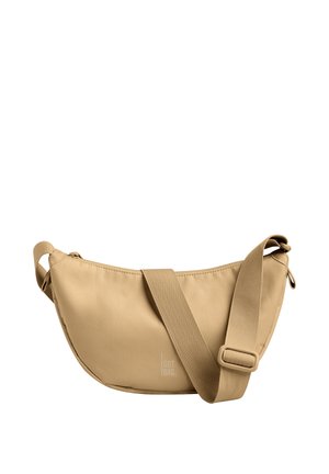 Borsa a tracolla beige con ampia tracolla regolabile e chiusura con zip, con logo "GOT BAG" poco visibile nella parte inferiore destra anteriore.