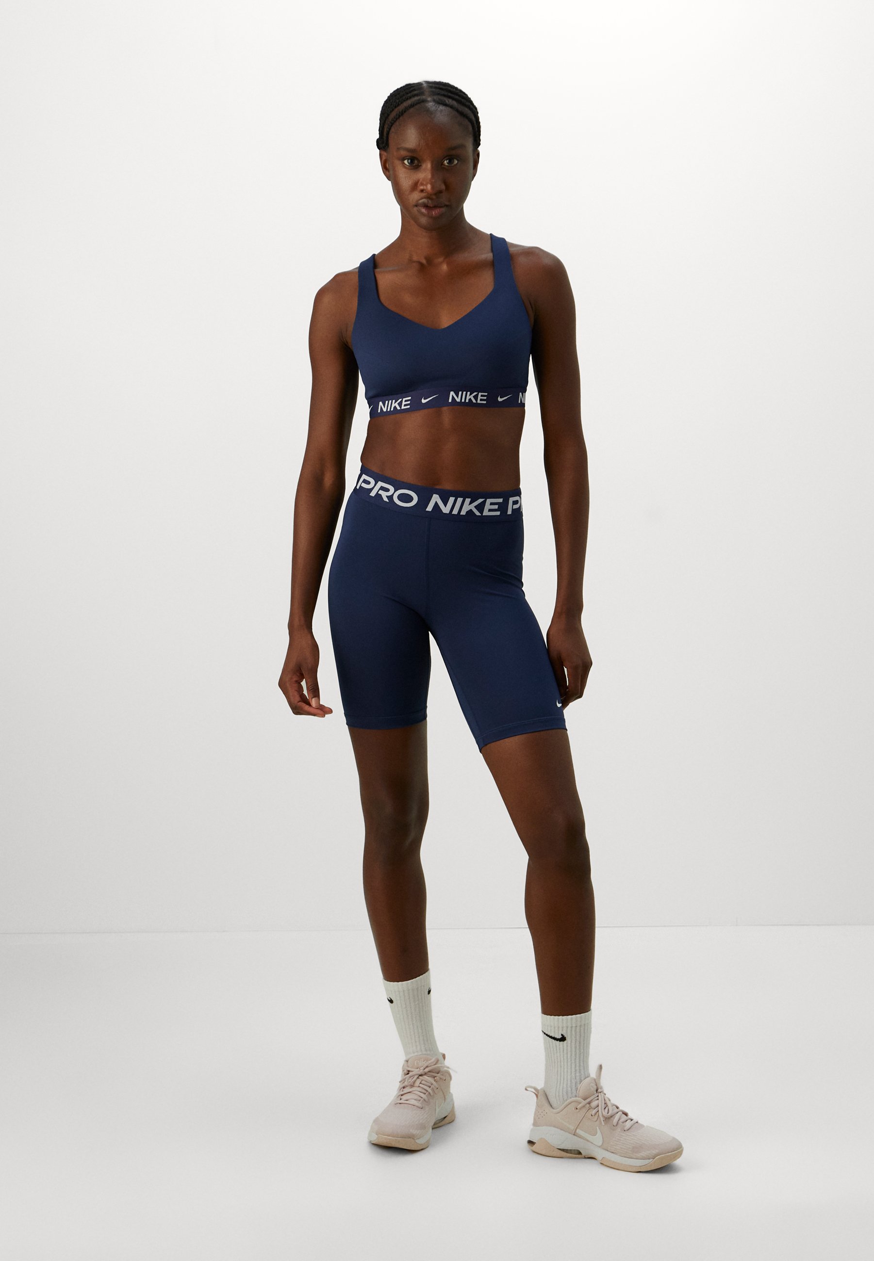 nike sports bra and biker shorts