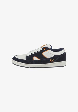 Navy blue suede and white fabric sneaker with orange accents, featuring a low profile, round toe, and lace-up design. Flat rubber sole.
