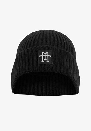 Black knitted beanie with vertical ribbing, featuring a black rectangular patch with a white logo on the front. Soft texture, fitted design.