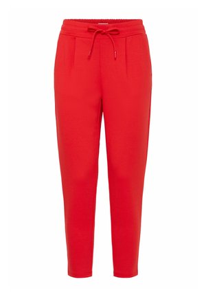 Rdeče trenirke z elastičnim pasom, zapiranjem na vrvico in stranskimi žepi. Prilagojen taper fit ter mehak tekstura blaga.