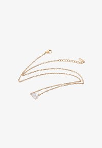 Sélectionné, gold-coloured