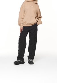 Pegador Jersey con capucha - sand