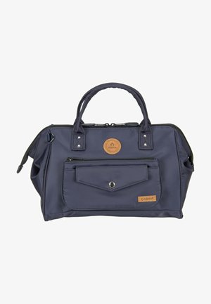 Navy blue handbag with double handles, front zip pocket, snap-button flap, and leather brand patches labeled "Cabaia."