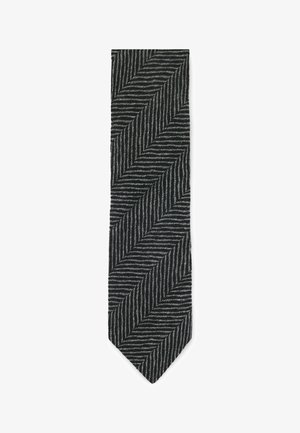 Svart och grå herringbone-slipset med ett texturerat tyg, som har en skarp, spetsig ände och ett diagonalt mönster längs hela längden.