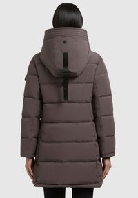 Puffer jacket in muted mauve, featuring a large hood, quilted texture, and black hardware details. Designed for warmth and functionality.