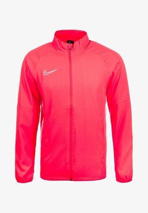 Giacca Nike in rosa brillante, realizzata in materiale liscio e leggero, con zip frontale, collo alto e logo Nike bianco sul petto.