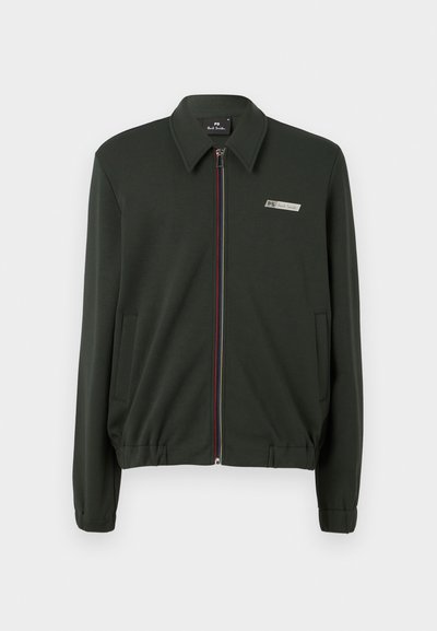 Mørkegrønn zip-up jakke laget av glatt stoff, med krage, to sidelommer og flerfargede glidelåser.