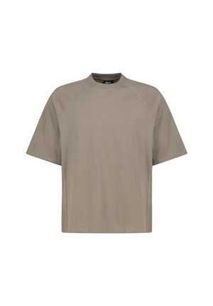 Beige oversized T-Shirt mit kurzen Ärmeln, Rundhalsausschnitt und Raglanärmeln, schlichtes Design, am Kragen mit dem Label SBLVL versehen.