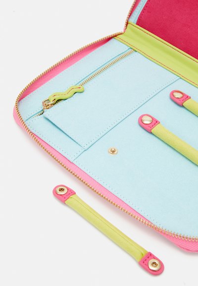Zippered wallet in light blue felt with pink accents. Features a lime green zipper pull, one interior zip pocket, and card slots with gold hardware.