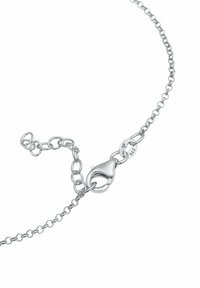Pulsera de cadena de plata con cierre tipo langosta y eslabones ajustables, textura suave, con un sello que indica plata de ley 925.