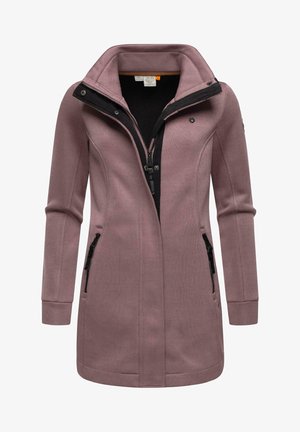 Long pink coat with a high collar, black zipper, and two zippered pockets. Made from textured fabric with a fitted design.