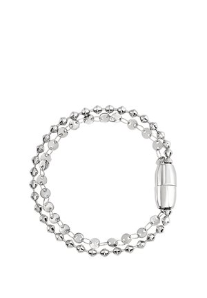 Bracelet en argent avec des maillons alternant entre sphériques et en forme de disque, doté d’un fermoir lisse et allongé pour la fermeture. Finition polie et texture brillante.