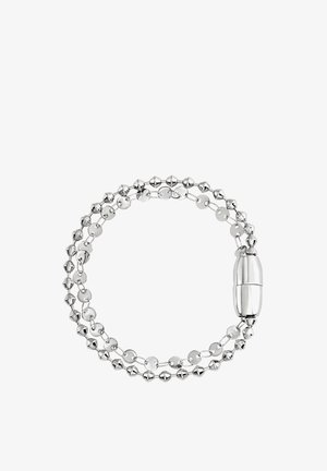 Pulsera de plata con eslabones alternados esféricos y en forma de disco, con un cierre liso y alargado. Acabado pulido y textura brillante.