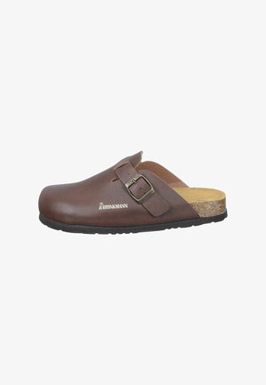 Brown leather clog with a buckle accent, cork footbed, and a black rubber sole, designed for comfort and casual wear.