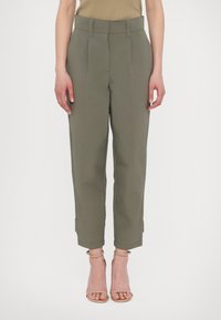 Light olive green trousers with a wide-leg design, pleats in front, and cuffed hems, made from a smooth, structured fabric.