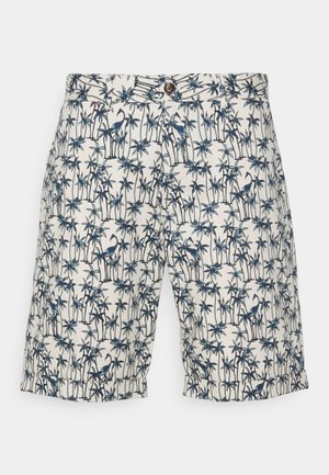 Shorts blancs avec imprimé de palmiers bleus et flamants roses, fermeture par bouton et poches latérales, posés à plat sur un fond blanc.