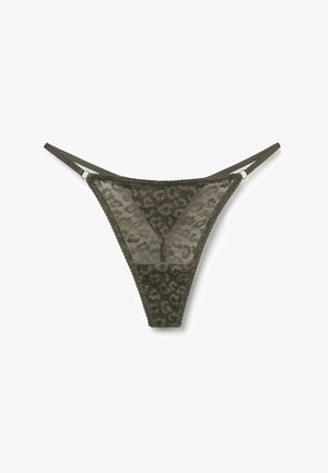 String tanga en dentelle vert foncé avec motif léopard et fines bretelles latérales ajustables sur fond blanc.