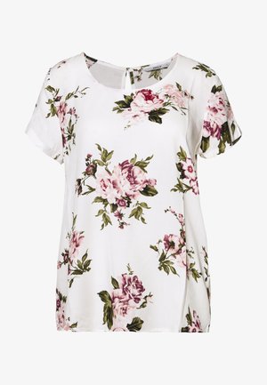 Witte blouse met korte mouwen, bedekt met een roze en paarse bloemenprint, ronde halslijn en een kleine knoopsluiting aan de achterkant.