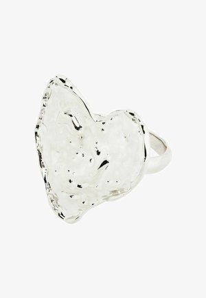 Silver ring with an irregular heart shape, featuring a glossy finish and textured surface. Band is smooth and circular.