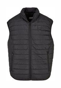 Černá vycpaná vesta s vysokým límcem a předním zipem, vybavená dvěma bočními kapsami na zip a nášivkou s logem na hrudi.