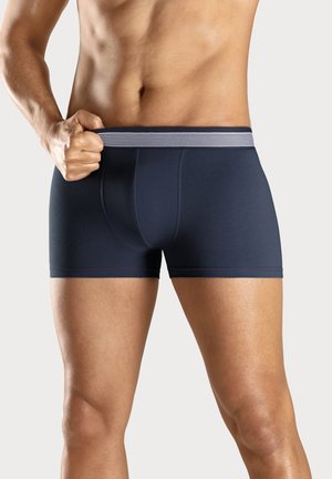 Navy blue boxer briefs made of smooth fabric with a fitted design, featuring a striped elastic waistband and a contoured pouch.