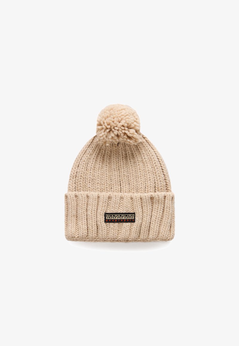 Beige knitted beanie with a ribbed texture, featuring a pom-pom on top and a black fabric patch with white and red text on the front.