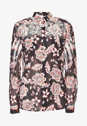 Przezroczysta czarna bluzka z kwiatowym wzorem w odcieniach różu i koralu, z koronkowym panelem na ramionach i zapięciem na guziki.