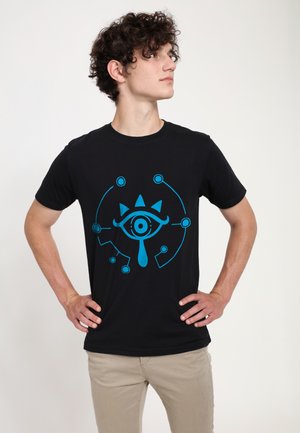 Black cotton T-shirt featuring a central blue graphic of an eye with triangular accents and circular elements, round neckline, short sleeves.
