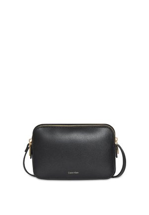 Calvin Klein FOIL LOGO ELONGATED - Taška cez plece - black/toasted coconut