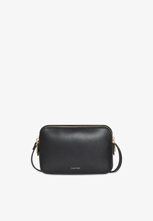 Calvin Klein FOIL LOGO ELONGATED - Taška cez plece - black/toasted coconut