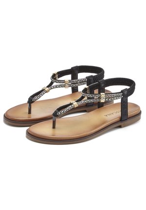 Black thong sandals with a textured strap featuring metallic accents and small gems, set on a light brown, flat sole.