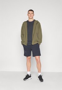 Under Armour UNSTOPPABLE JACKET - Outdoorová bunda - marine/green/black