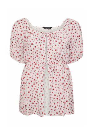 Valkoinen pusero, jossa punainen ruusukuvio, pussimaiset lyhyet hihat, neliömäinen pääntie ja edessä nyörit rinnalla ja vyötäröllä.