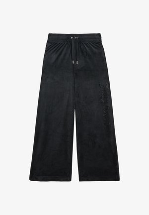 Pantaloni larghi neri in morbido velluto con cintura elastica e cordino, caratterizzati da un logo embellito con strass sul lato.