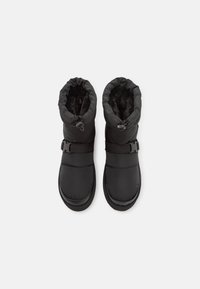 Black insulated winter boots with adjustable strap and drawstring closure, lined with soft black faux fur, shown from top view.