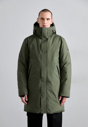 Olive green parka with a high collar, front snap closures, side pockets, and adjustable hood, made from a smooth, water-resistant material.