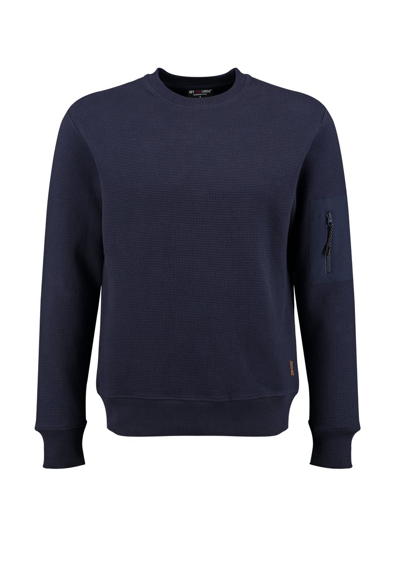 Marineblauw longsleeve sweatshirt met een gestructureerd patroon, ribbelboorden en een ritszak op de linker mouw. Simpele ronde hals.