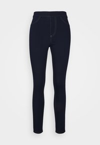 Leggings elásticos de color azul marino con una textura suave, cinturilla alta y costuras en contraste. Presentan detalles de falsos bolsillos frontales.