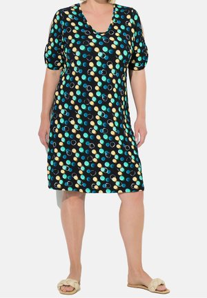 Black dress with a scoop neck, short puff sleeves, featuring a multi-colored polka dot pattern in turquoise, yellow, and white.