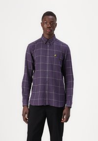 Purple checkered shirt with long sleeves, button-down collar, and yellow logo. Features a grid pattern with contrasting white lines.