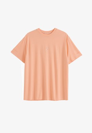 Pfirsichfarbenes T-Shirt mit kurzen Ärmeln und rundem Ausschnitt, mit kleinem weißen, auf der Brust zentriert gesticktem Text.